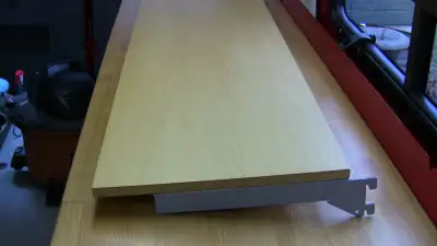 NICE WOOD SHELVES c/w METAL BRACKET . Measures 4 foot (47 5/8in)long X 15 3/4in Wide Wood might be m...