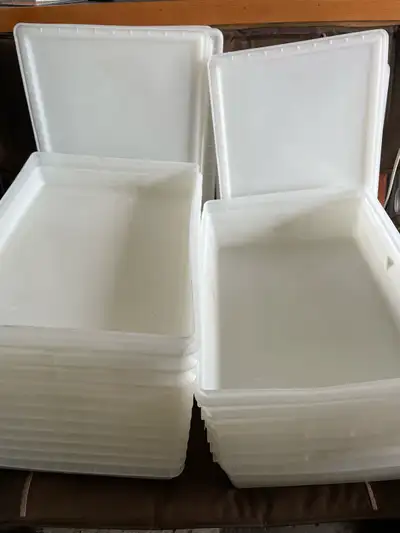 Used plastic storage containers with lids. 15 pieces