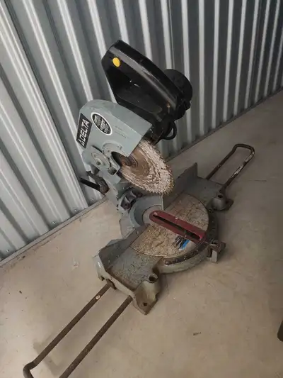 This Delta miter saw is a dependable power tool that has been well-loved and shows clear signs of it...