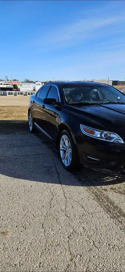 2010 ford Taurus nice car has blue and black two tone seats has always been realible got a new engin...