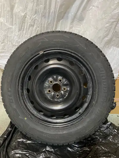 I'm offering a set of four winter tires on rims. These Bridgestone Blizzak DM-V2 tires, sized at 225...
