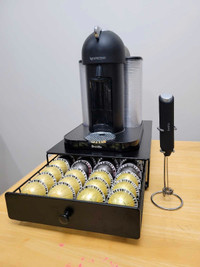Nespresso Vertuo coffee maker, pods and frother.