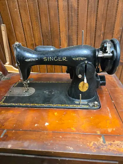 Nice Vintage Singer Sewing Machine. Needs some TLC. For a collector it would be a great project to r...