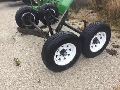 2 - 5000 lb 6 stud trailer axles comes with springs rims and tires. $500 obo