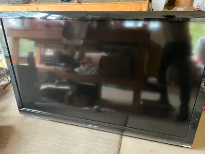 FLAT PANEL TV IN GOOD WORKING CONDITION WITH REMOTE CONTROL IS A 60 INCH SHARP AQUOS WAS USED FOR A...