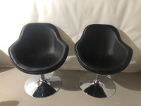 2 black swivel chairs