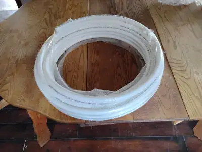 This is a brand new coil of PEX tubing, 1/2 inch diameter, still sealed in its original plastic wrap...
