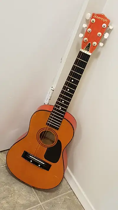 Sovereign six string 31" children's size guitar model # 3300. All wood construction. This guitar dat...