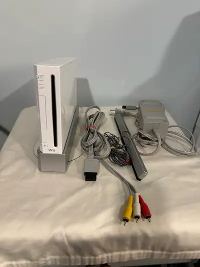 Selling a Wii Console Comes with: The console power supply sensor bar AV cords Wii Stand Everything...