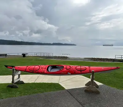 Red Delta 17' kayak with rudder system. Spacious hatches with lots of room, plus day pod. Adjustable...