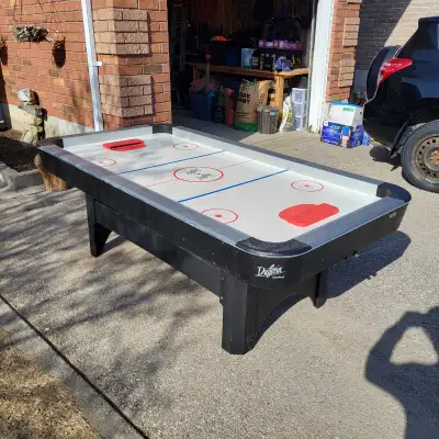 Full size air hockey table, fan works and comes with all pieces to play. - Minor scuffs on edges fro...