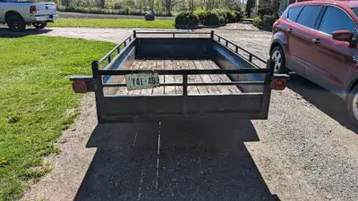 5'x10' utility trailer, 3500lbs axle, larger tires with spare, Triton snowmobile trailer, both in de...