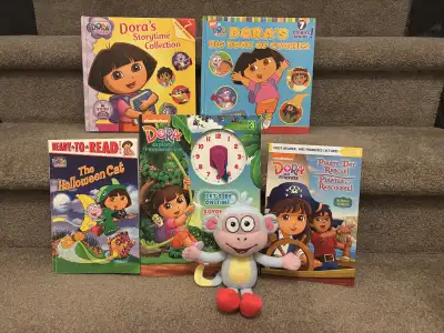 Dora the Explorer in gently used condition. Includes; 1 Boots Stuffy 2 Storytime Collections (7 stor...