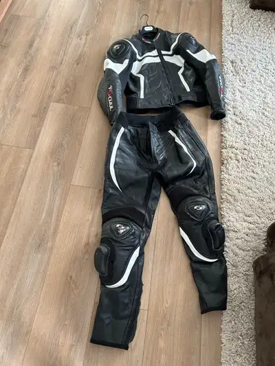 Full race suit does separate in two peice Size 56 top and bottom Tschul brand No rips good condition