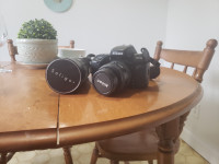 Nikon f70 analog SLR camera with telephoto lens
