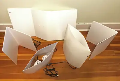 Lightweight studio light kit with 2 light panels, 2 reflector panels and stand for backdrop. Very si...