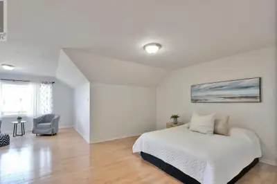 Luxurious master bedroom with attached roman bath/standing shower like a bachelor unit in a single f...
