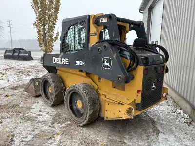 2015 John Deere 318E with only 1195 hours! Nice machine, pre emissions. Joystick controls, enclosed...