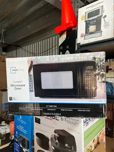 Mainstays 0.7 Cu ft Countertop Microwave   – Black & White, View more