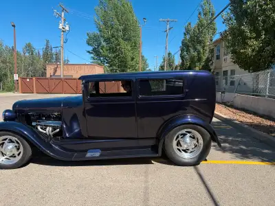 This is all steel built with stretched original fenders, suicide doors. 4” chop lowered on modern fr...
