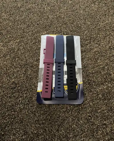 Selling a set of 3 new Fitbit bands for Fitbit Inspire in blue, plum, and black. They are a size lar...