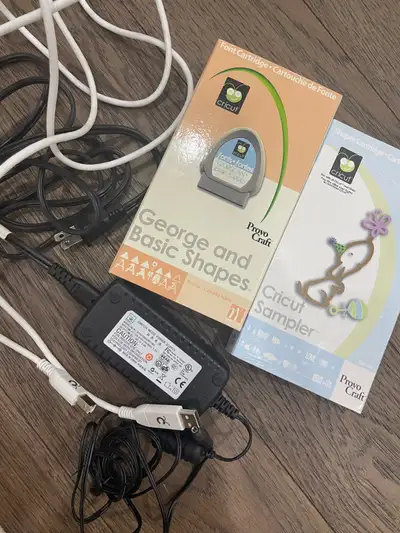 Cricut cables and two cartridges from my older machine.
