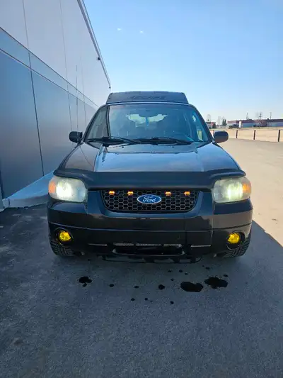 -factory remote start -factory sub and amp (sounds pretty good) -back up sensor -heated seats -sunro...