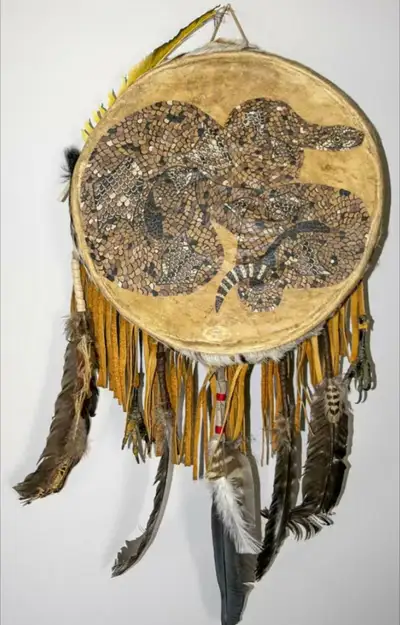 Wonderful Iroquois drum . Hand crafted and painted rattlesnake. Animal Hide, wild bird feathers and...