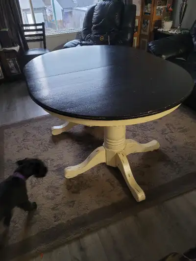 Dinning table oval double stand 5 feet long 45 inches wide comes with a 18 inch leaf and 6 chairs if...