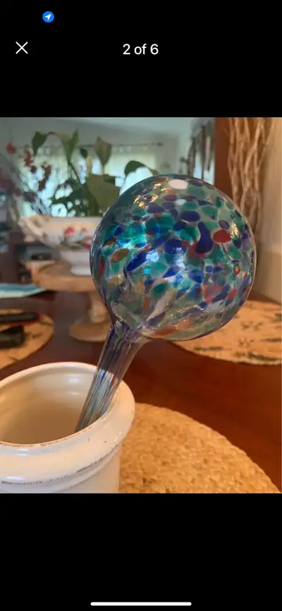 • GIFTED • NEVER USED • MULTI-COLOURED • WATERING BALLS • SIZE: 11” INCHES • $15 • KEEPS PLANTS HYDR...