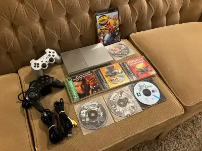 PS2 Slim Silver console, controllers, 8 games, View more