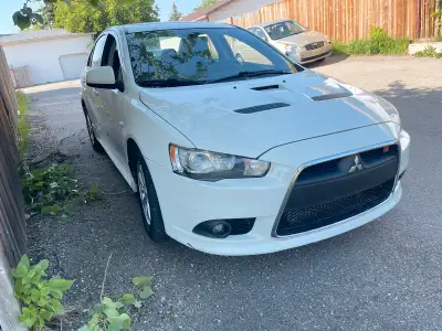 Looking to part ways with my sporty 2011 Mitsubishi Lancer Ralliart, a turbocharged four-door sedan...