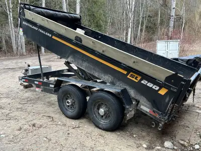 Good condition, low hours but some dents, a broken hinge and one 2x8 pressure treated side board is...