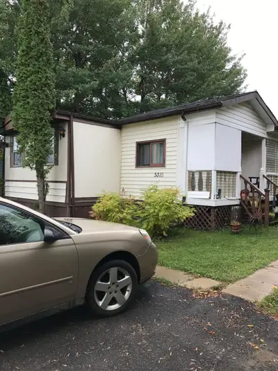 Trailer with separate garage and two vehicle driveway for 1200$ rent.
