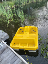 2 person paddle boat, yellow, for sale.