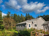 Country cottage with one acre of land for sale