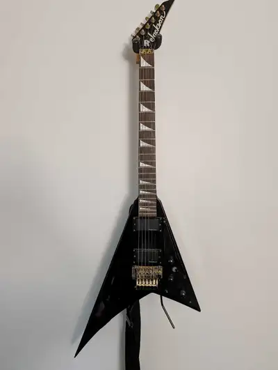 Selling my used Jackson Pro Series Randy Rhoads Flying V guitar, known for its sharp design and powe...