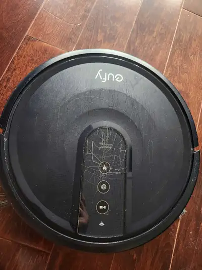 Scratches visible on top. Includes side brushes. Model number RoboVac 25C.works great battery life o...