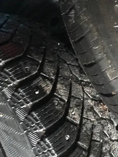Selling a set of used 215/55R17 winter tires mounted on brand new winter rims, tires still have Stud...
