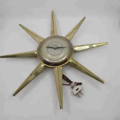 Add a touch of mid-century modern flair to your home with this used United Starburst Clock. This eye...