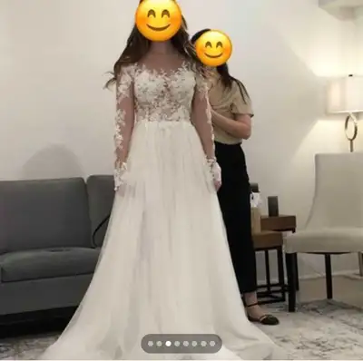 $1200 brand new wedding dress. Never wore, ended up going with a different style. Happy to send extr...