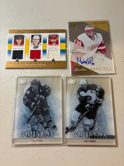 Different years of Upper Deck Trilogy hockey cards a variety of rookie cards and insert cards. Each...