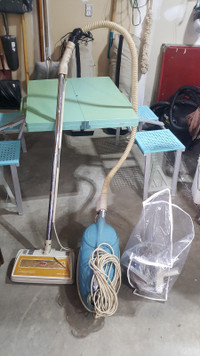 Old vacuum with attachments 