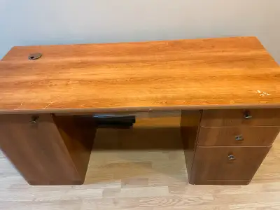 This is a sturdy wood-look desk, perfect for a home office or study space! It features a traditional...