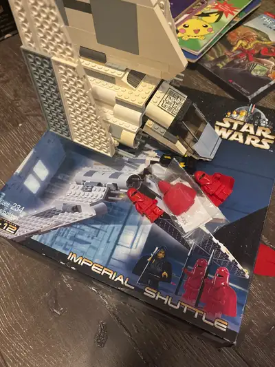 Includes box Lego and book. Original red figure was chew by my dog. So included is one from eBay tha...