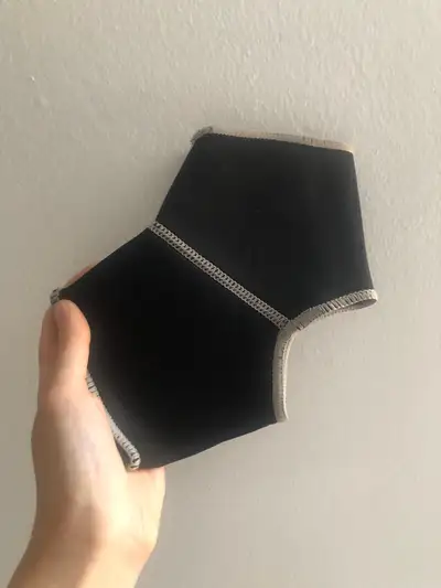 Tag says it’s washable. Selling a black ankle brace. Tried on but a smidge too large for my foot. Li...