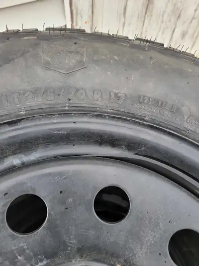 Studded tires like new on wheels 6x5.5 bolt pattern.