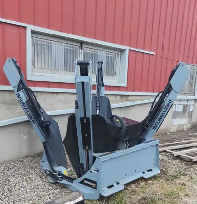 Almost new Baumalight ST440 skid steer attach tree spade Setup for Cat machine Top shape yet.