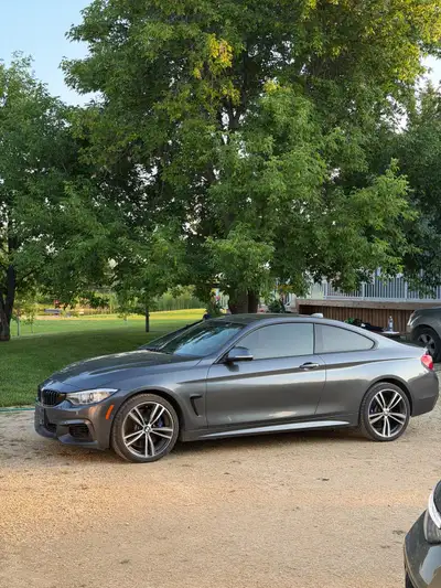 This stunning, well-maintained BMW 4-Series Coupe features a sporty silhouette, a vibrant red leathe...