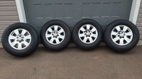 Four Michelin Defender LTX tires with 18" rims. Size 275/65R18